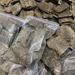 Artificial agarwood often has a uniform appearance, lighter weight, and emits a burnt or harsh smell even at low temperatures when burned.