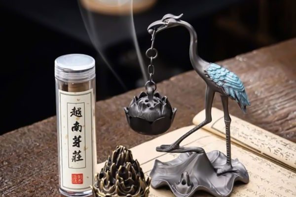 Bird-shaped incense holder designed to support burning incense