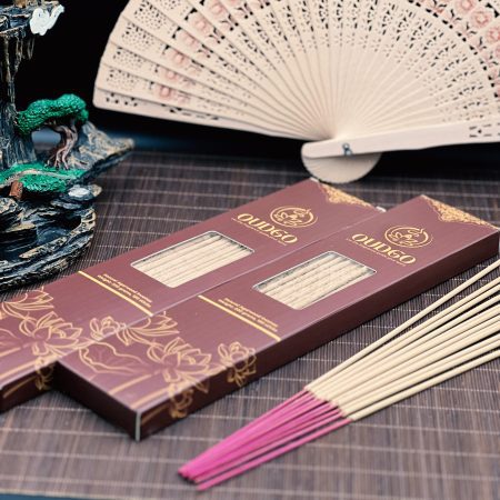 Two Oudgo agarwood incense stick boxes with loose long sticks