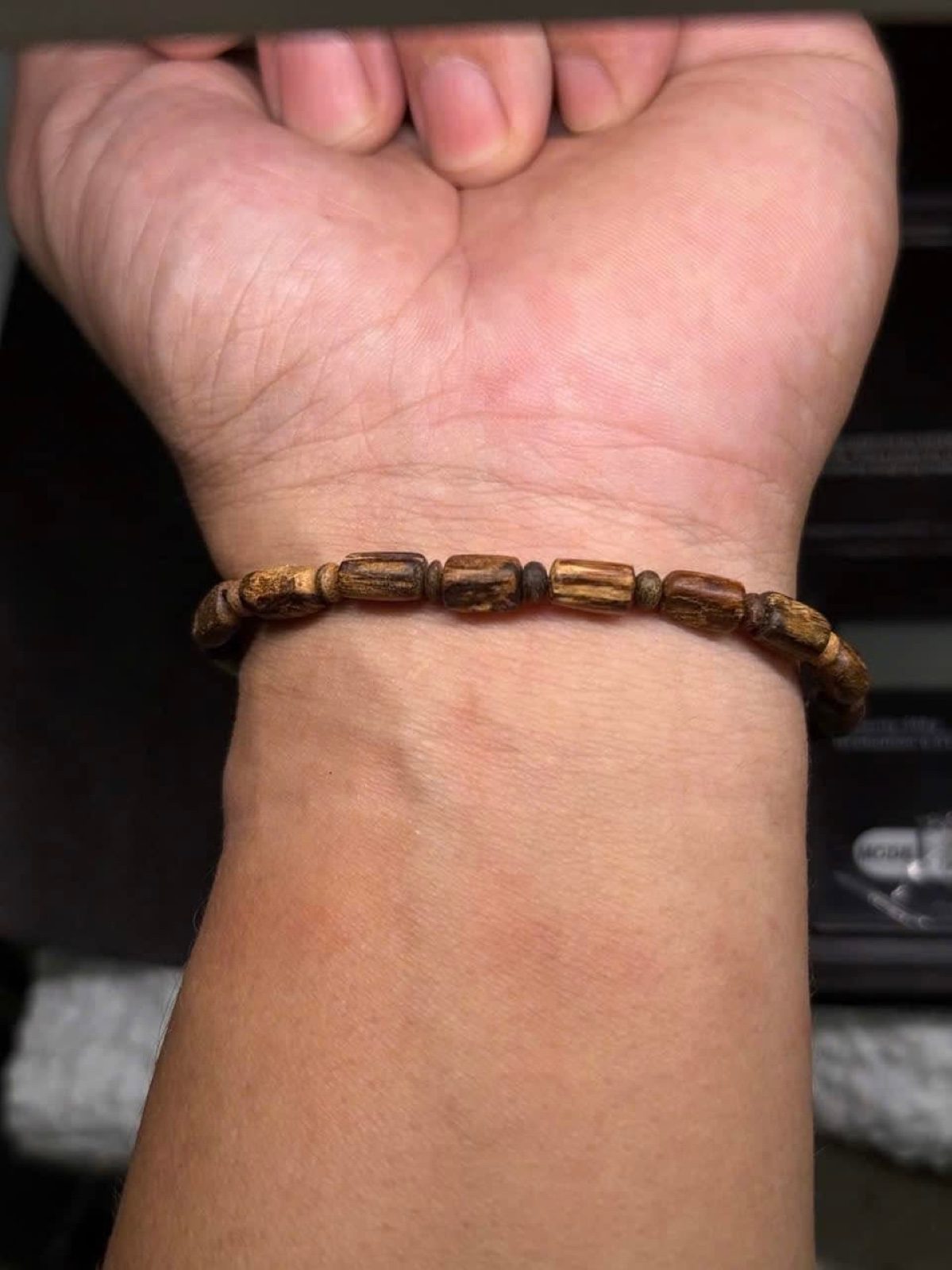 Tarakan agarwood bracelet worn on wrist for size reference